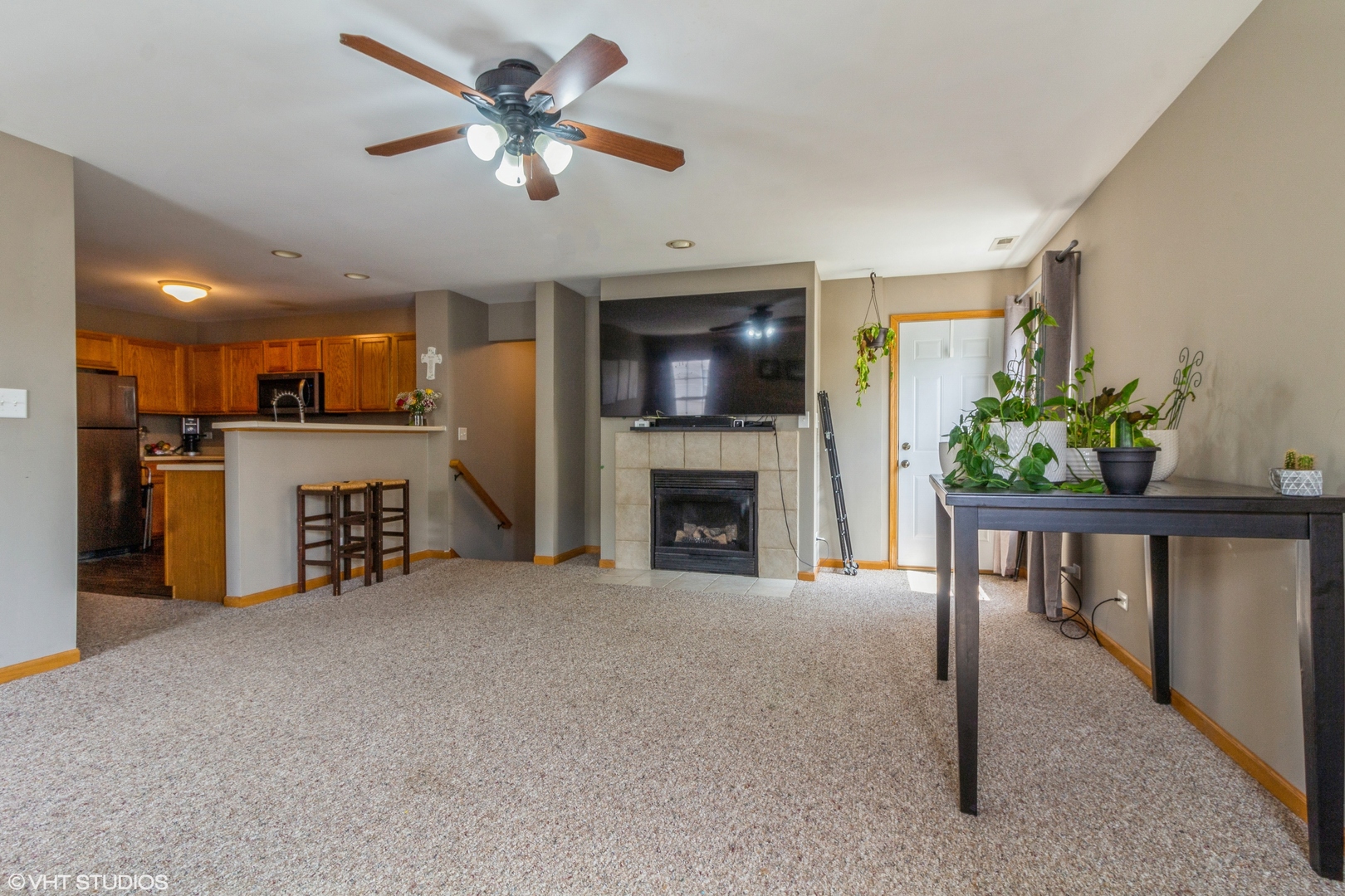 2029 Frantum Road, Unit 2029 Sycamore, IL 60178 - Photo 4 of 18 a view of a livingroom with furniture and a fireplace