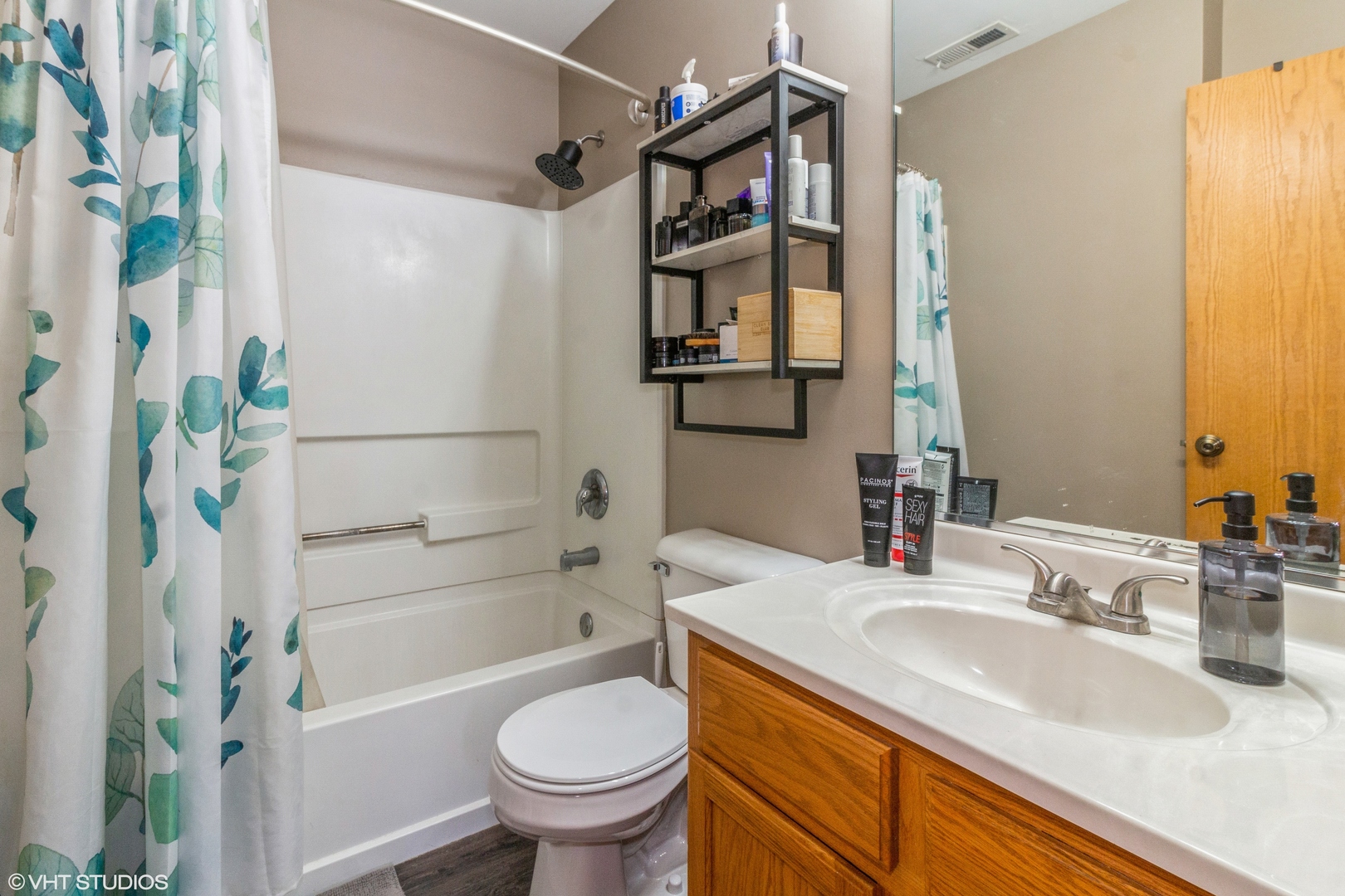 2029 Frantum Road, Unit 2029 Sycamore, IL 60178 - Photo 9 of 18 a bathroom with a sink toilet and shower