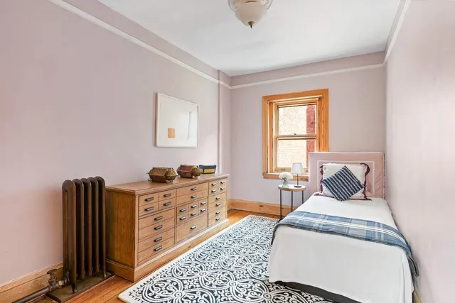 a living room with furniture a window and a fireplace