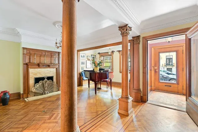 a view of a livingroom with furniture window and wooden floor