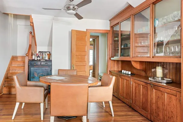a view of a large kitchen with furniture and wooden floor