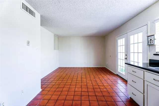 a kitchen with a sink appliances and a window
