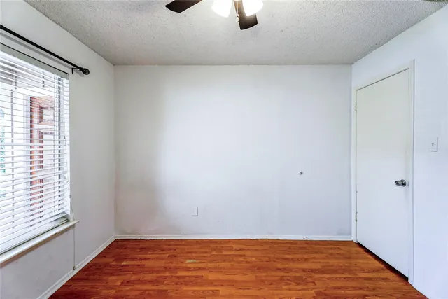 a large kitchen with cabinets and stainless steel appliances