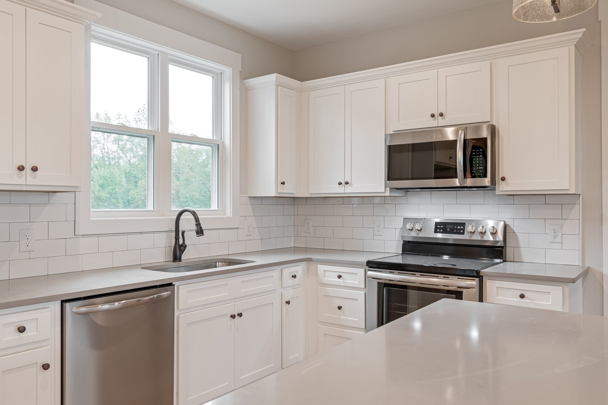 2675 Monte Murrey Road Lewisburg, TN 37091 - Photo 18 of 61 a kitchen with white cabinets appliances a sink and a window