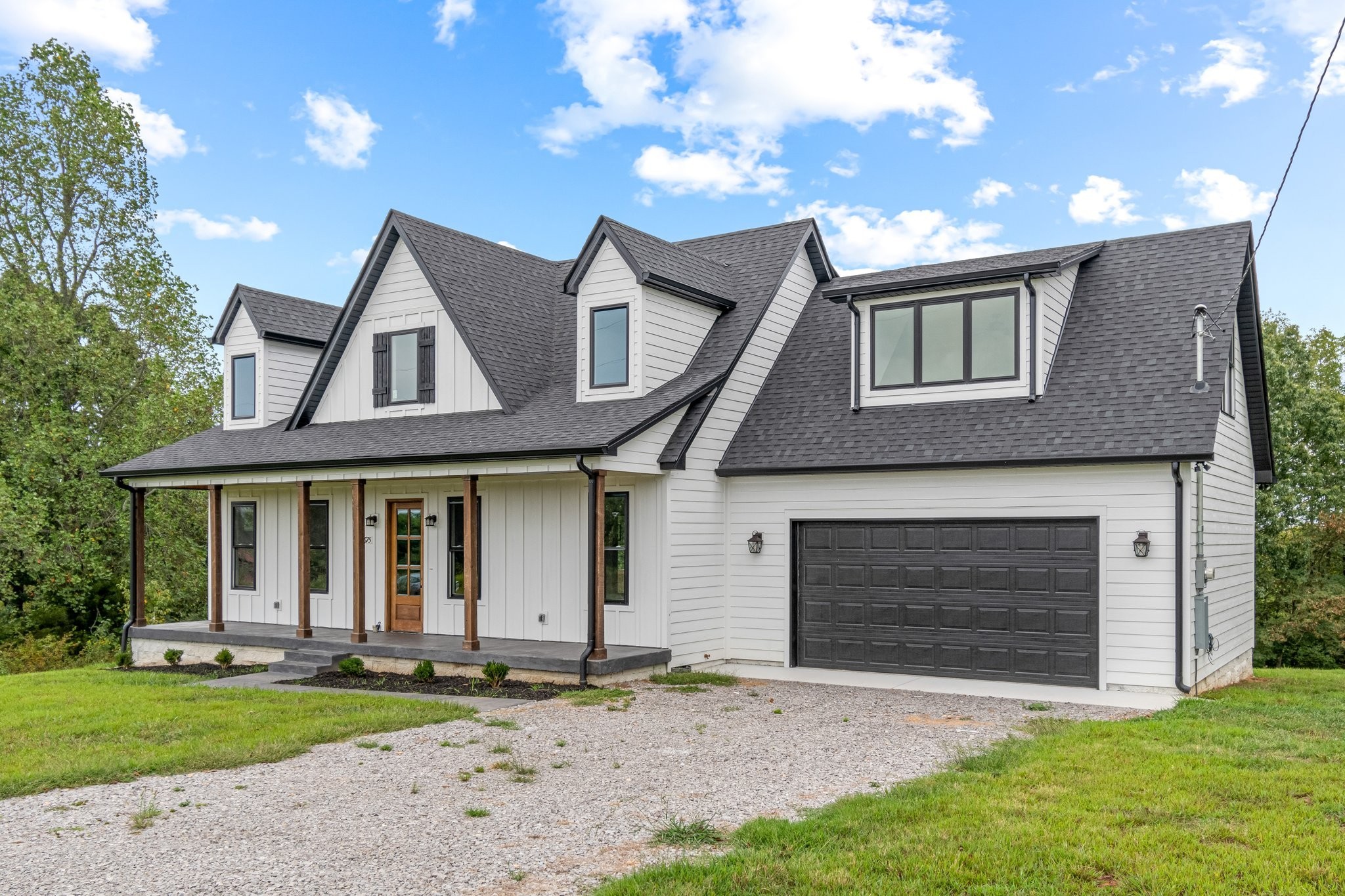 2675 Monte Murrey Road Lewisburg, TN 37091 - Photo 2 of 61 a front view of a house with a yard and garage