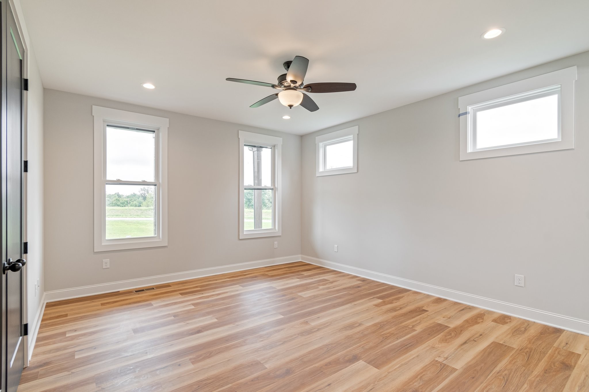 2675 Monte Murrey Road Lewisburg, TN 37091 - Photo 24 of 61 an empty room with wooden floor ceiling fan and windows