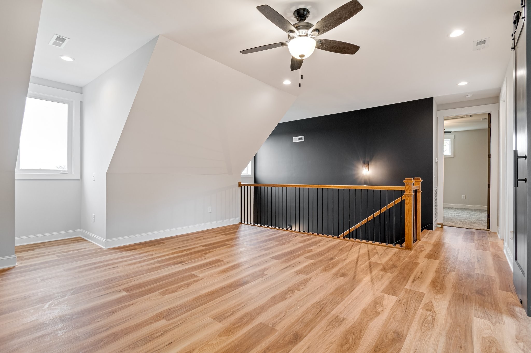 2675 Monte Murrey Road Lewisburg, TN 37091 - Photo 36 of 61 an empty room with wooden floor fan and windows