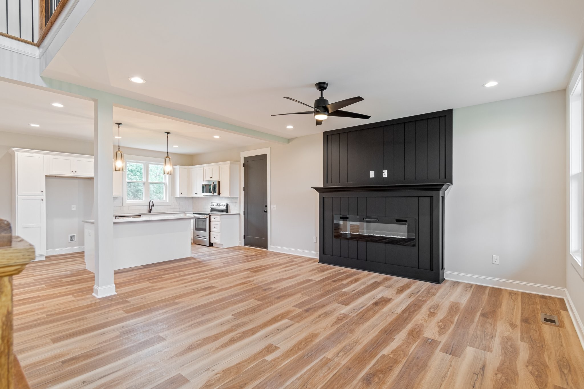 2675 Monte Murrey Road Lewisburg, TN 37091 - Photo 8 of 61 a large white kitchen with kitchen island a sink dishwasher a stove and a refrigerator with wooden floor
