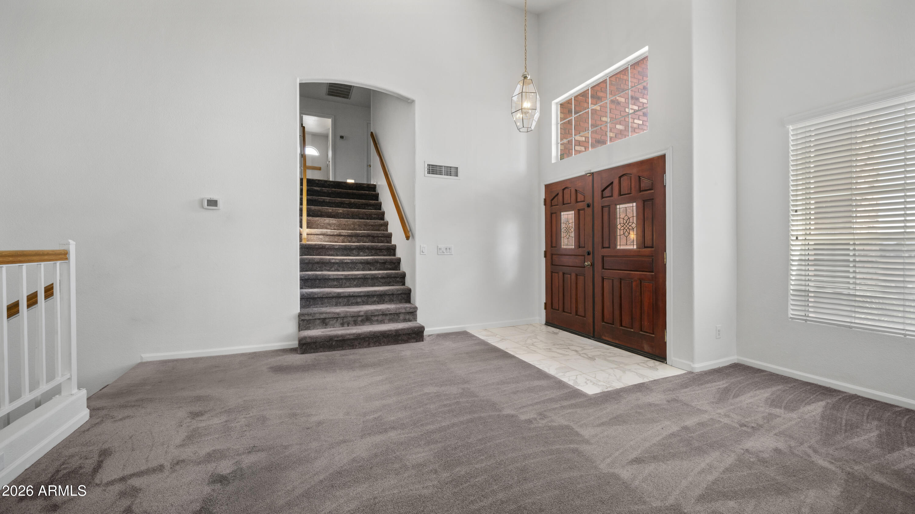 6620 West Redfield Road Glendale, AZ 85306 - Photo 13 of 33 a view of an empty room with stairs