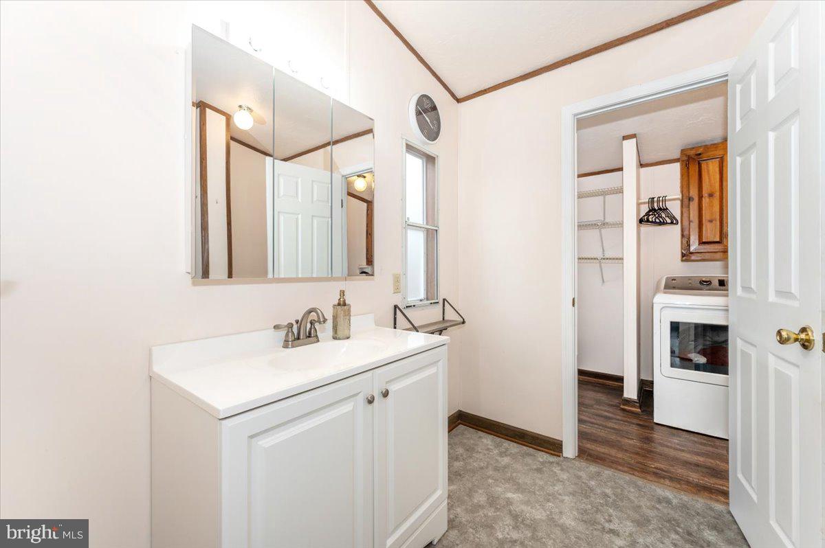 105 Relative Way Falling Waters, WV 25419 - Photo 13 of 42 a bathroom with a sink and a mirror