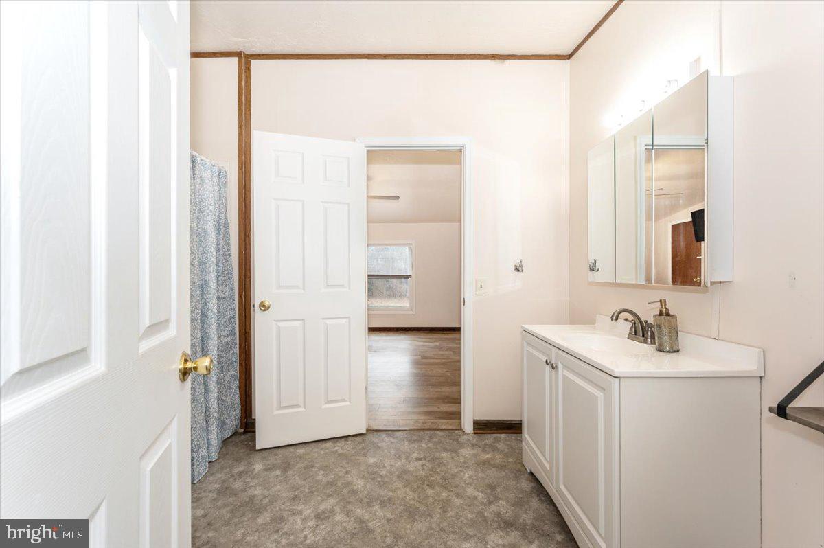 105 Relative Way Falling Waters, WV 25419 - Photo 15 of 42 a bathroom with a sink a toilet and shower