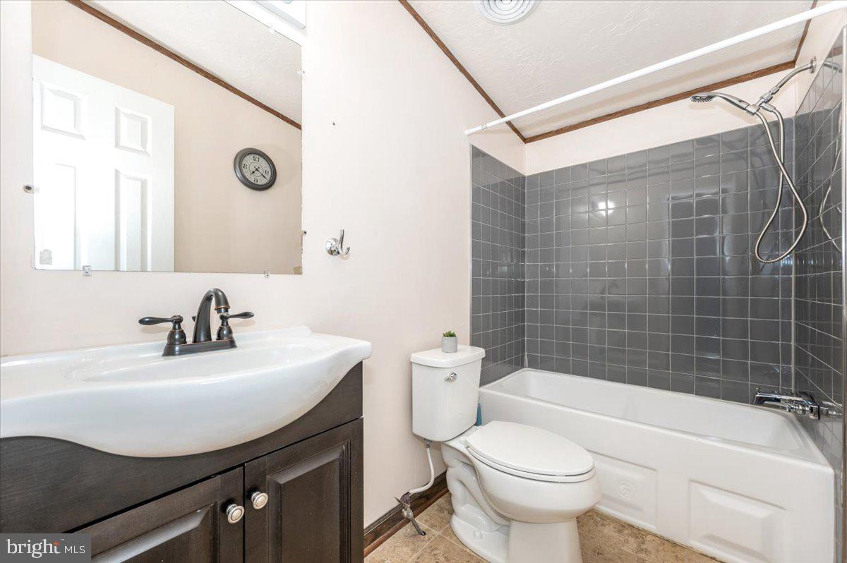 105 Relative Way Falling Waters, WV 25419 - Photo 21 of 42 a bathroom with a sink a toilet and shower