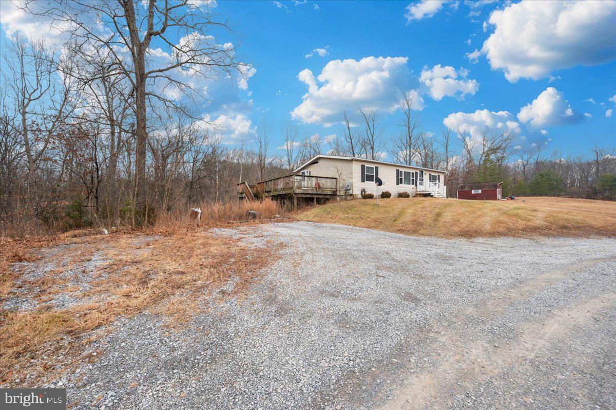 105 Relative Way Falling Waters, WV 25419 - Photo 34 of 42 a view of dirt yard