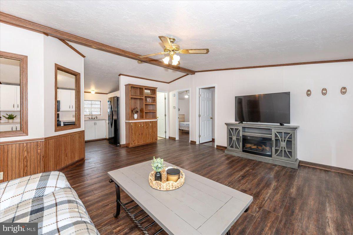 105 Relative Way Falling Waters, WV 25419 - Photo 4 of 42 a living room with furniture and a flat screen tv