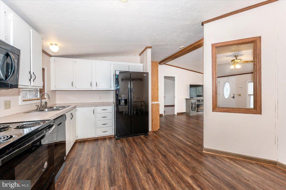 105 Relative Way Falling Waters, WV 25419 - Photo 8 of 42 a kitchen with stainless steel appliances a refrigerator and a stove top oven