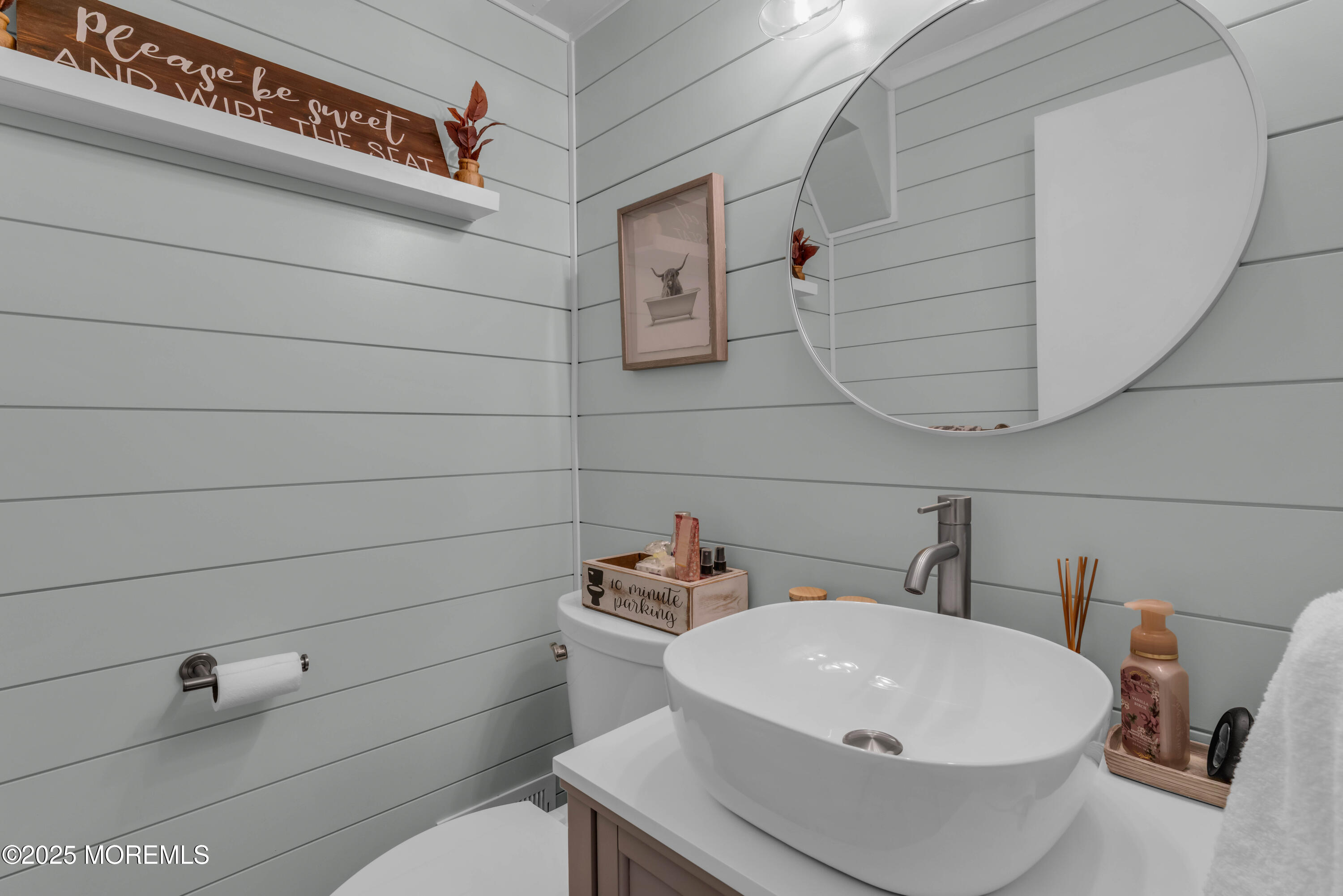 38 Kiwi Loop Howell, NJ 07731 - Photo 12 of 32 a bathroom with a sink a mirror and vanity