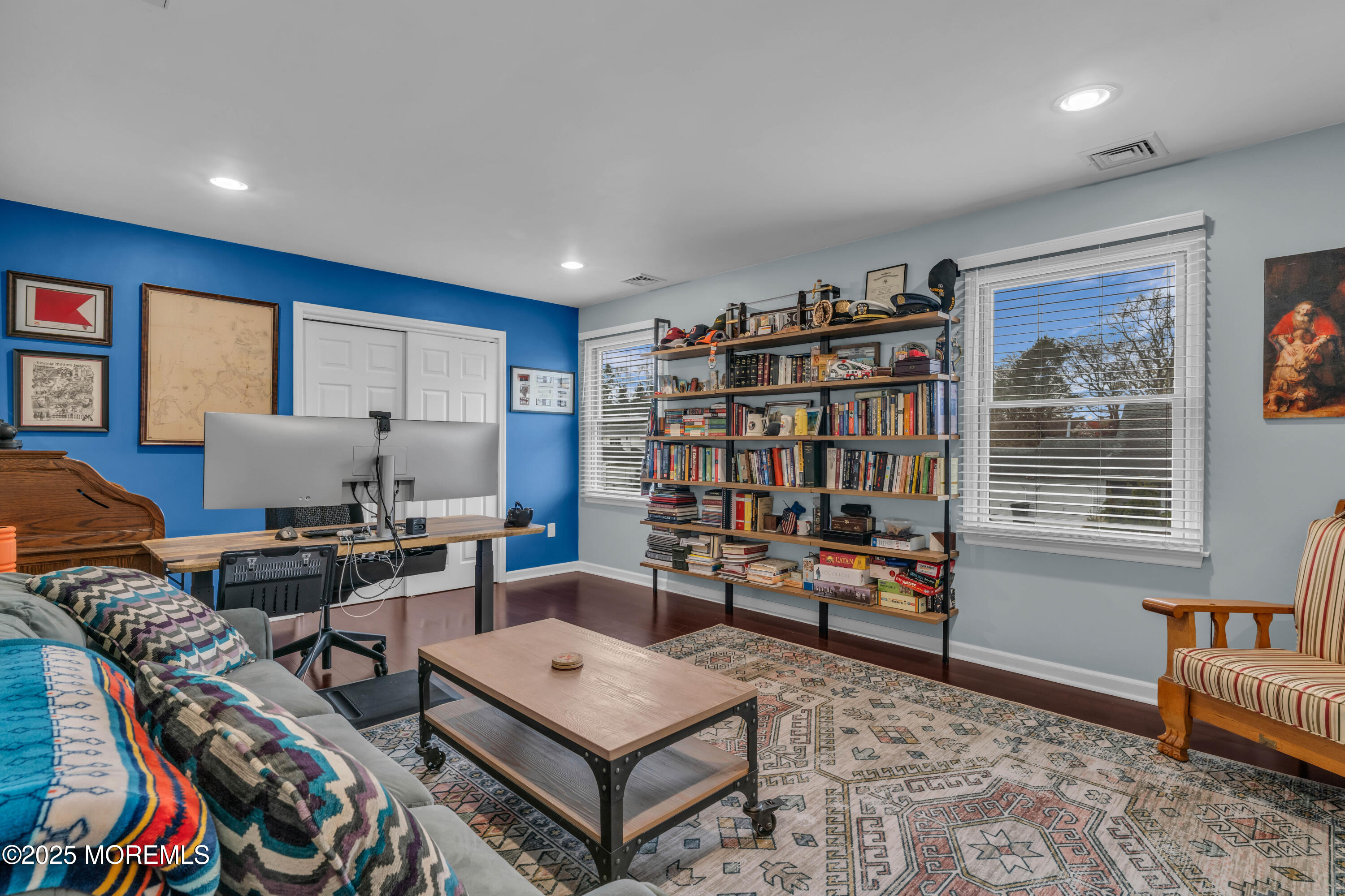 38 Kiwi Loop Howell, NJ 07731 - Photo 13 of 32 a living room with furniture a bookshelf and a window