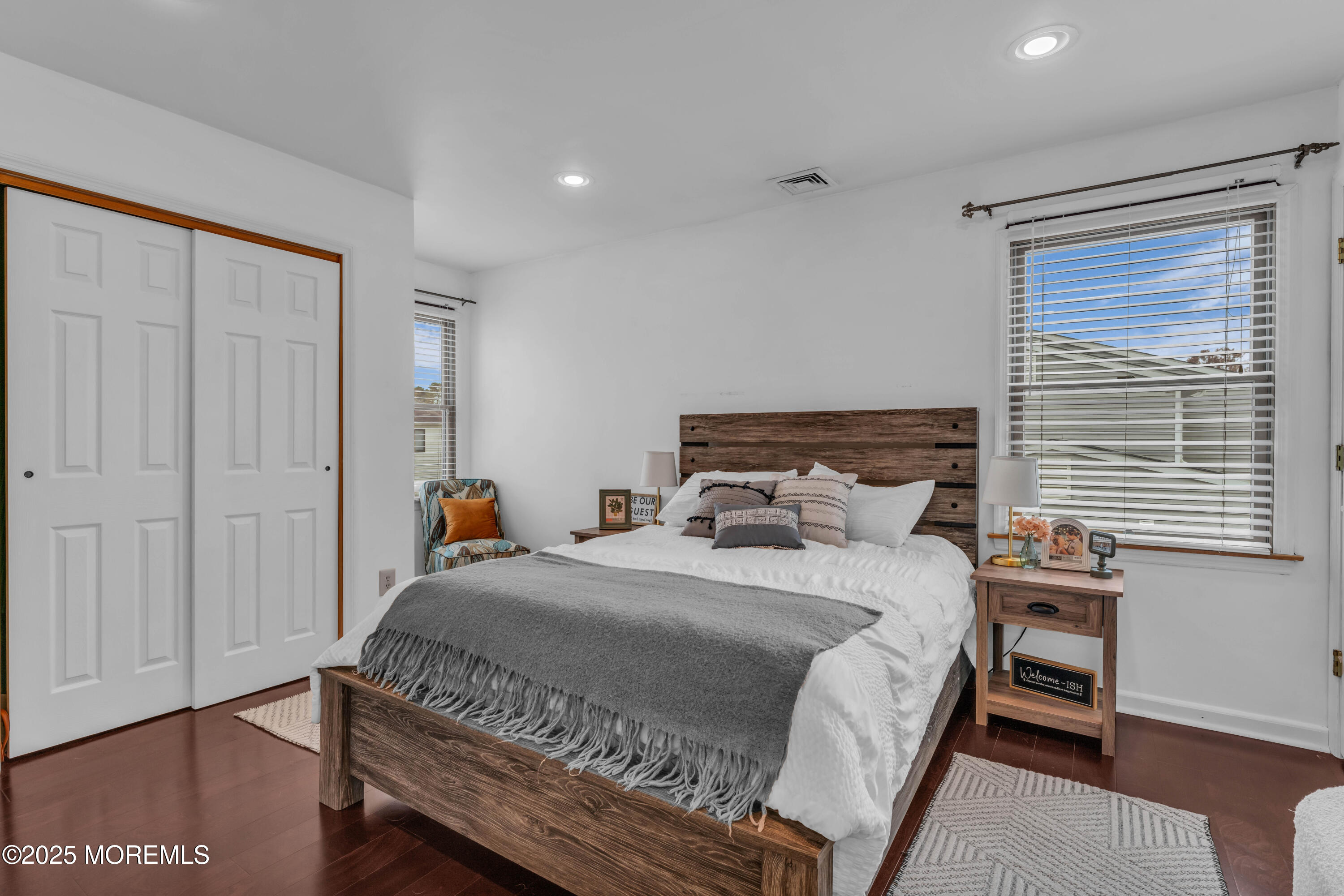 38 Kiwi Loop Howell, NJ 07731 - Photo 15 of 32 a bedroom with a bed a window and wooden floor
