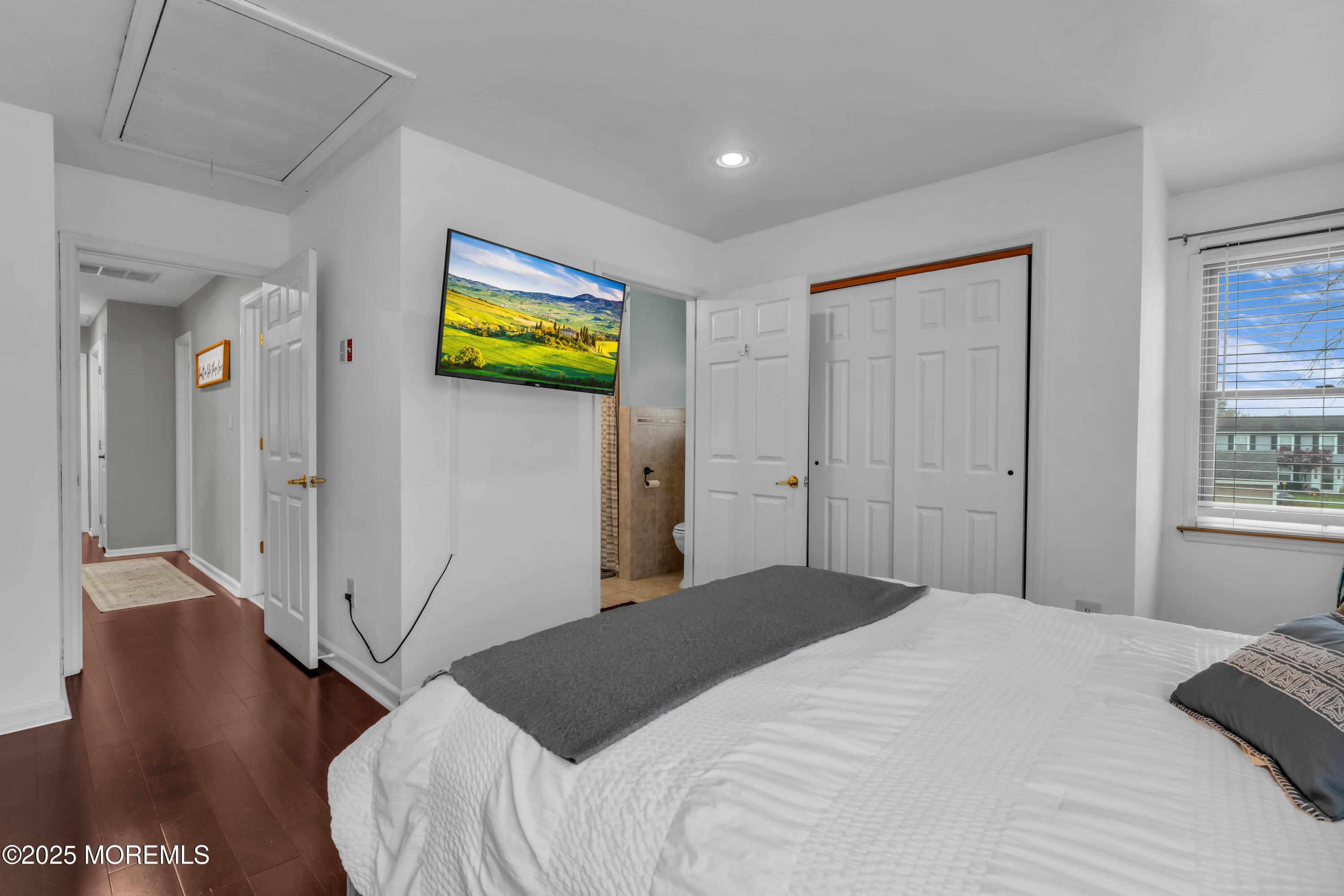 38 Kiwi Loop Howell, NJ 07731 - Photo 16 of 32 a bedroom with a bed and a painting on the wall