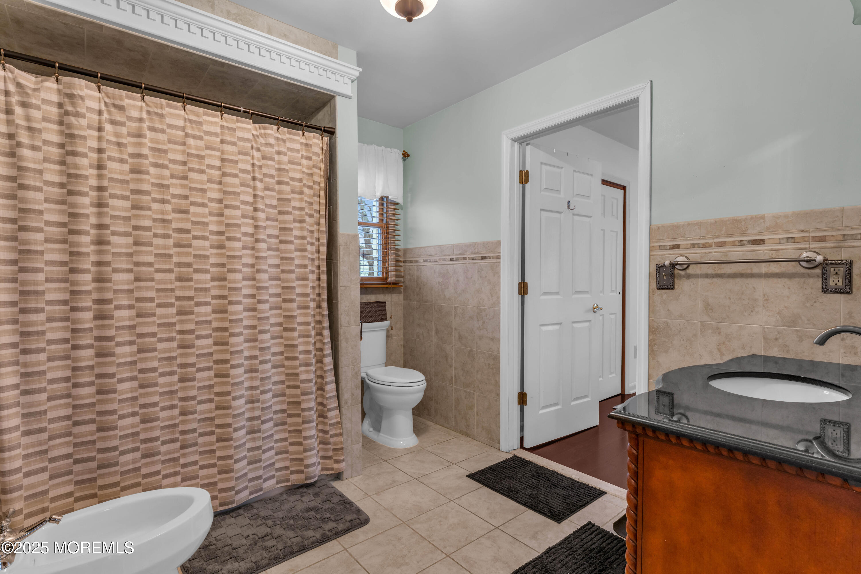 38 Kiwi Loop Howell, NJ 07731 - Photo 17 of 32 a bathroom with a granite countertop toilet and a sink