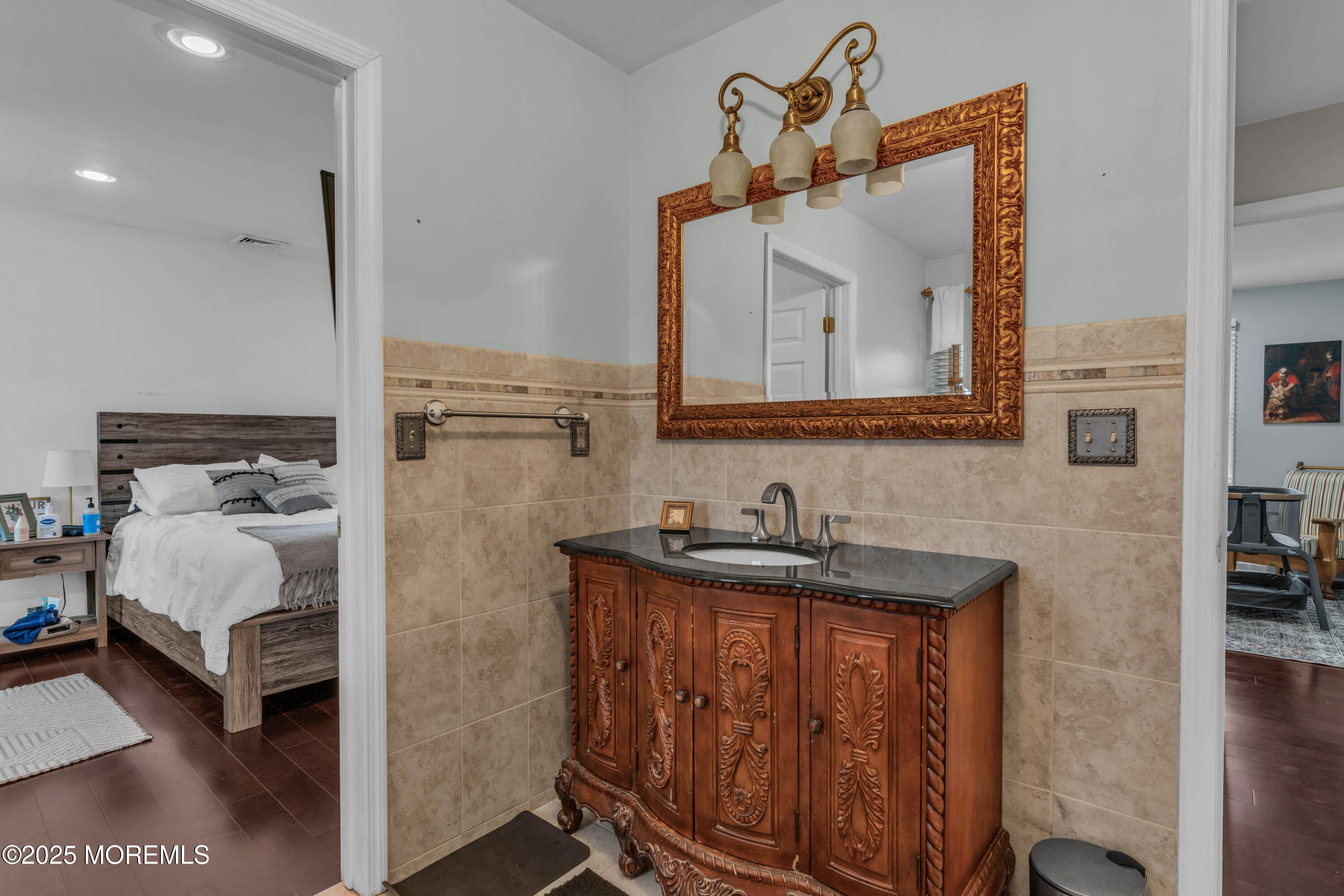 38 Kiwi Loop Howell, NJ 07731 - Photo 18 of 32 a en suite bathroom with a sink and a mirror