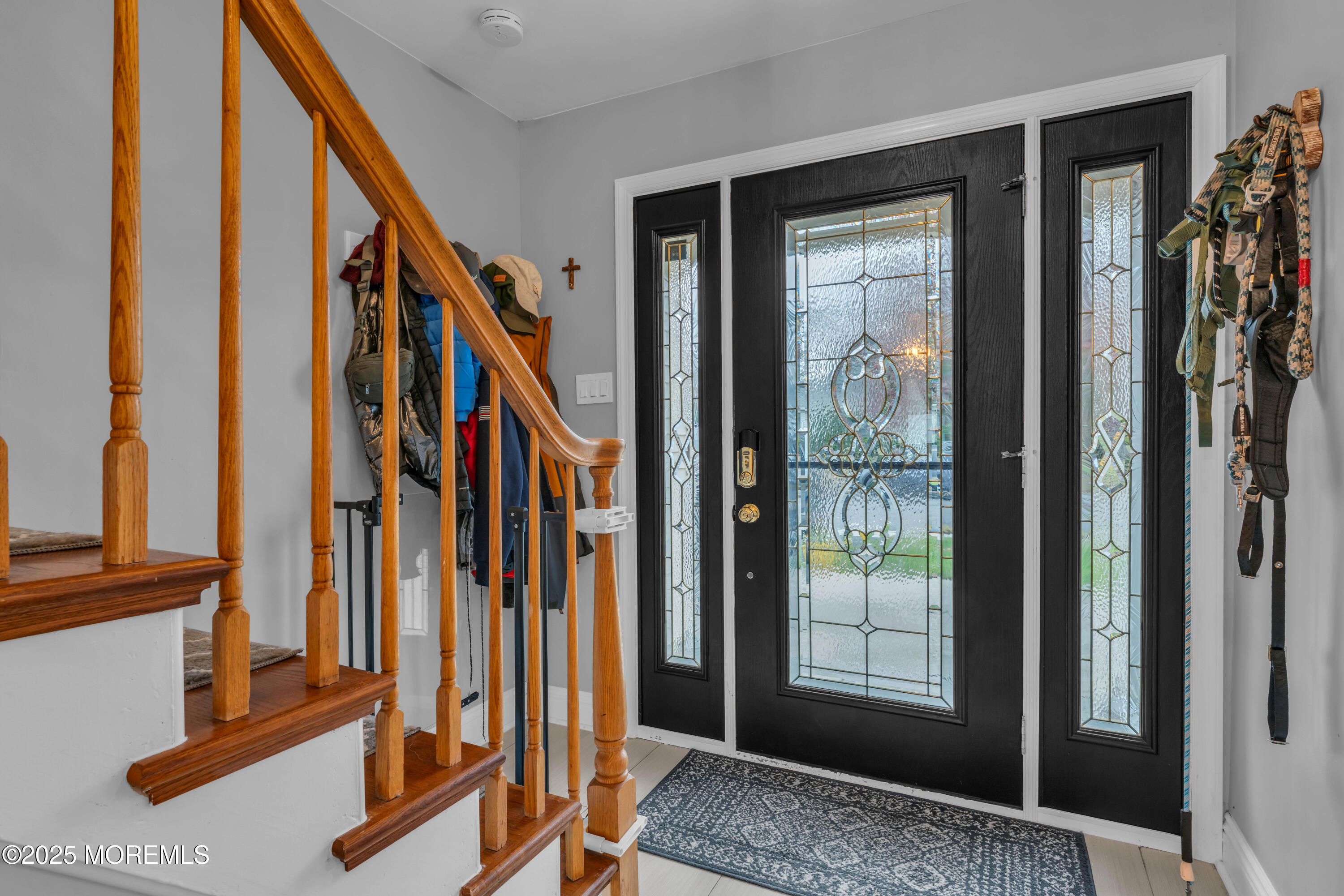 38 Kiwi Loop Howell, NJ 07731 - Photo 2 of 32 a view of an entryway with wooden floor and door