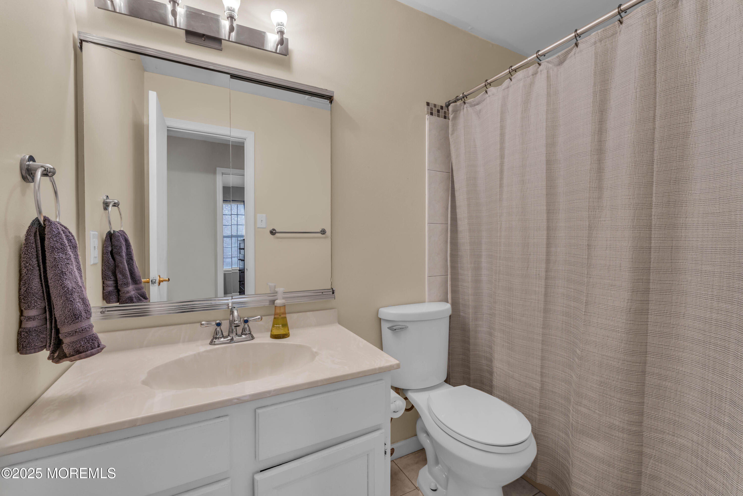38 Kiwi Loop Howell, NJ 07731 - Photo 22 of 32 a bathroom with a toilet a sink and a mirror