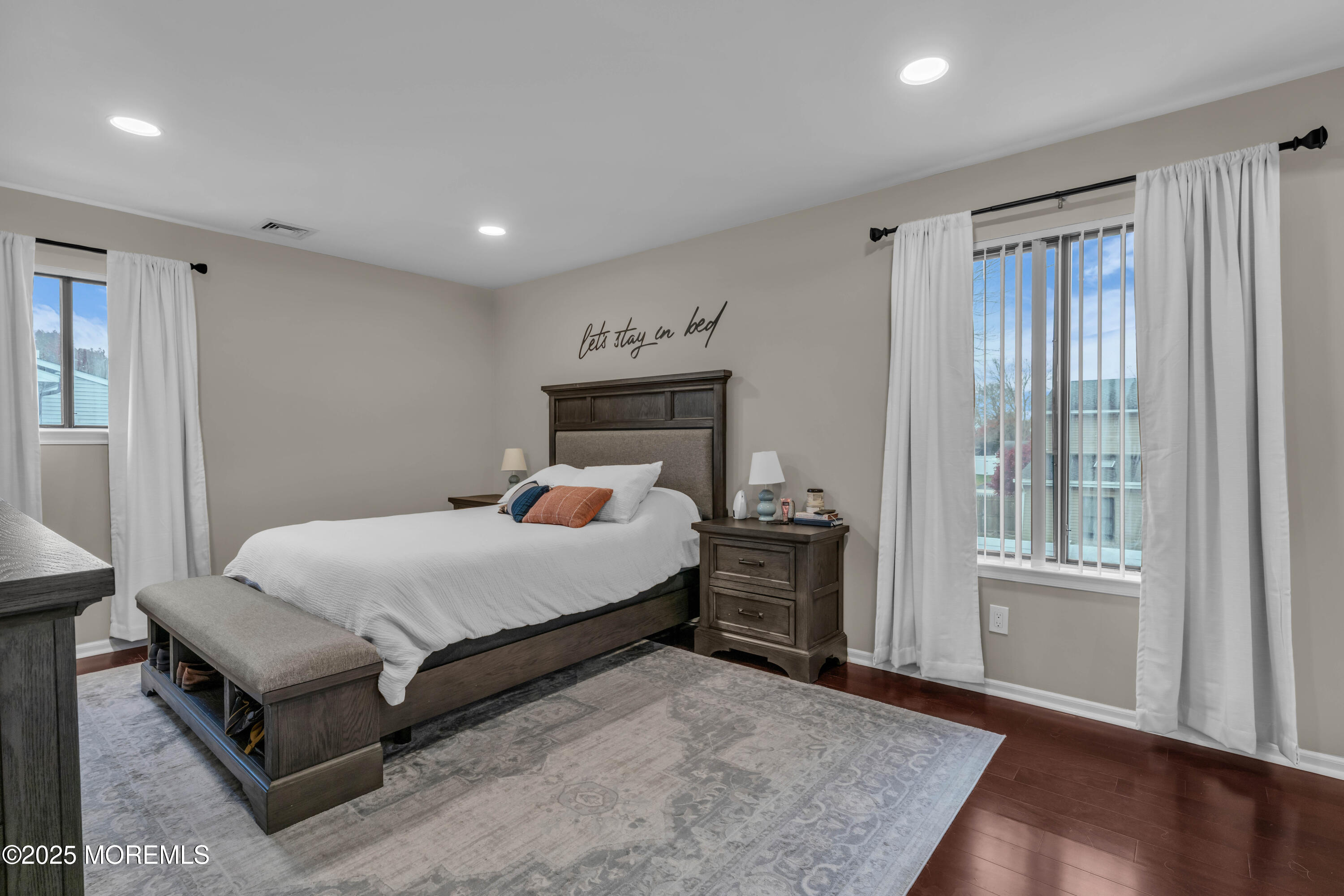 38 Kiwi Loop Howell, NJ 07731 - Photo 23 of 32 a bedroom with a bed and wooden floor