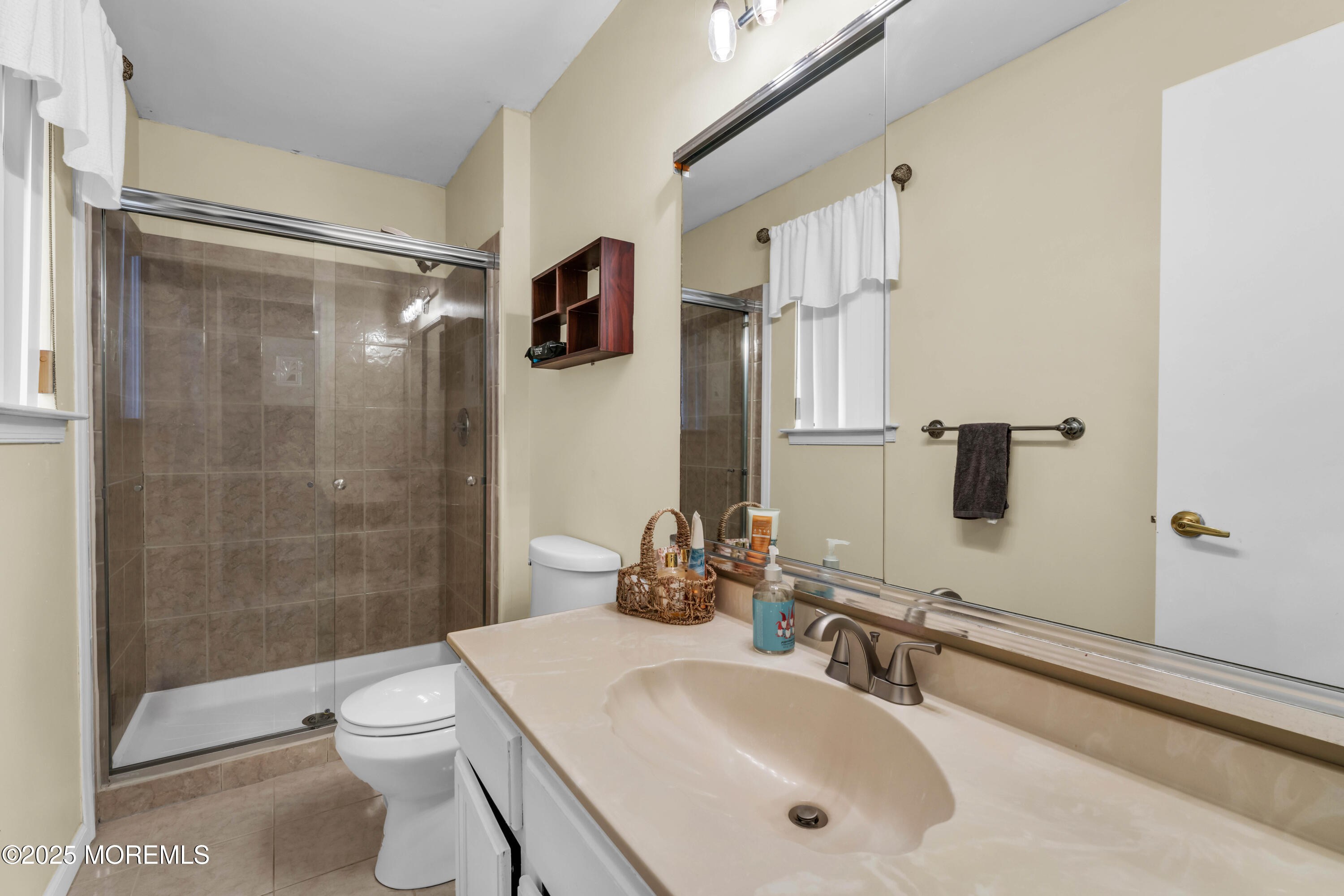 38 Kiwi Loop Howell, NJ 07731 - Photo 25 of 32 a bathroom with a sink toilet and shower