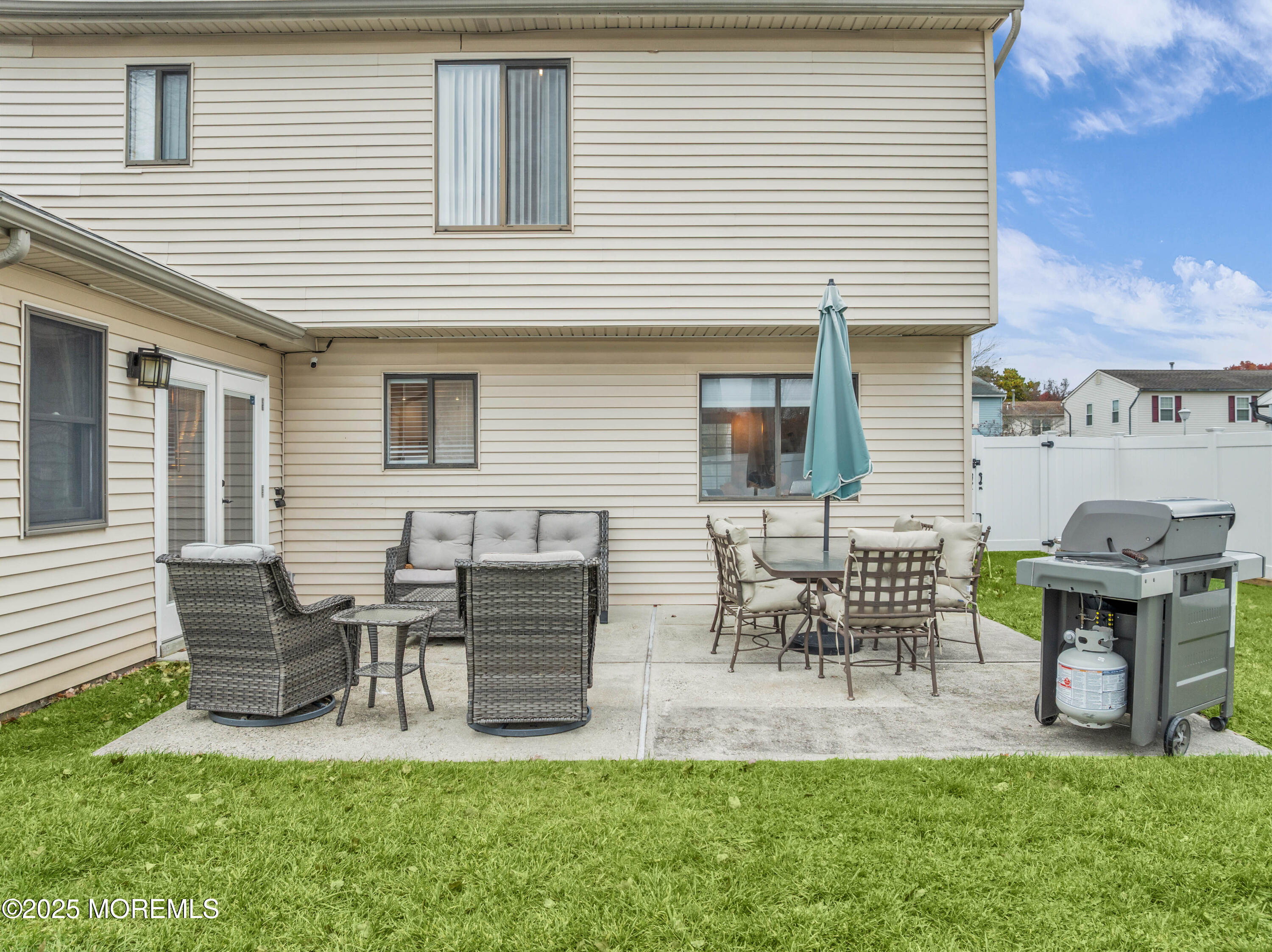 38 Kiwi Loop Howell, NJ 07731 - Photo 28 of 32 a house view with outdoor seating space and garden