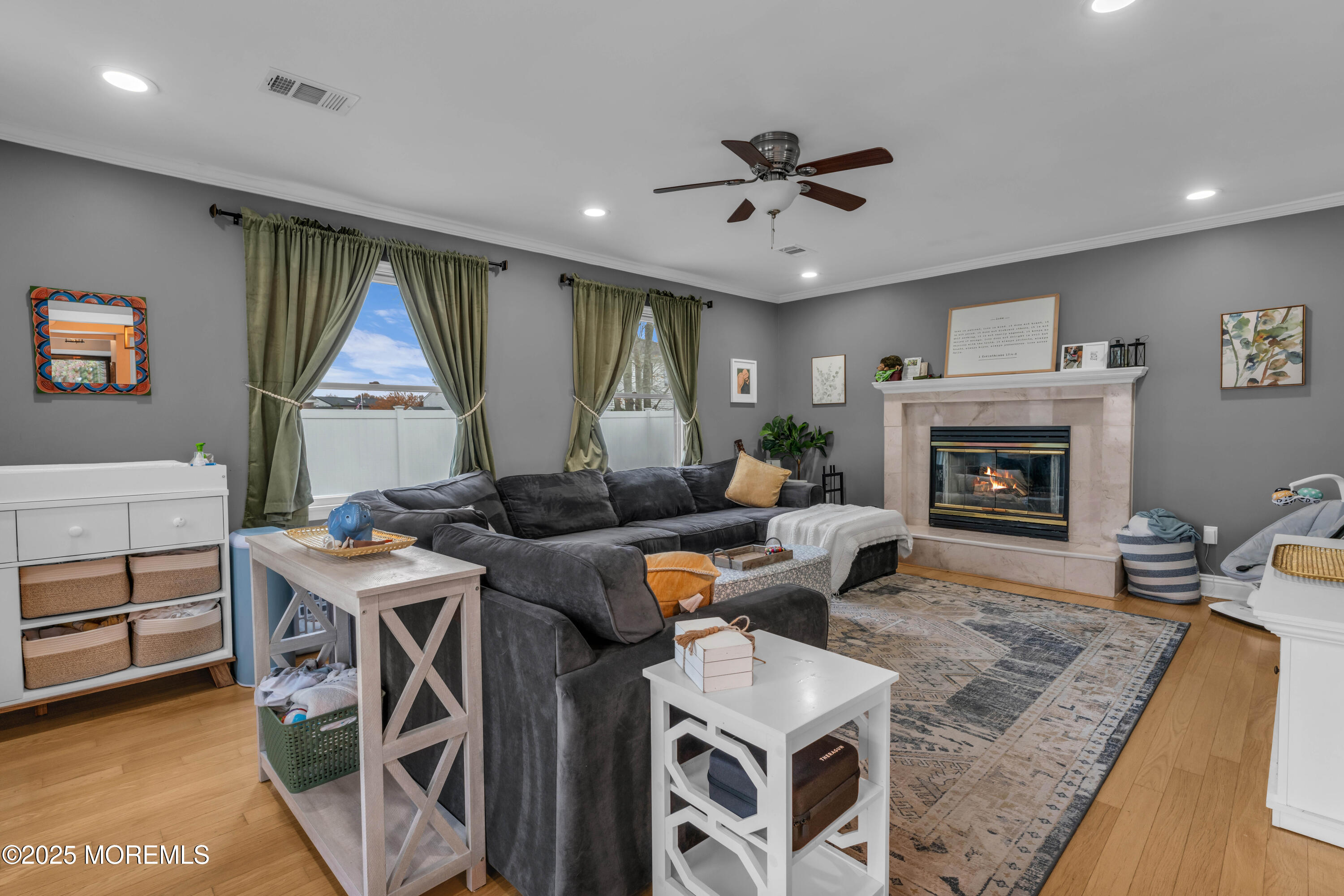 38 Kiwi Loop Howell, NJ 07731 - Photo 9 of 32 a living room with furniture a window and a fireplace