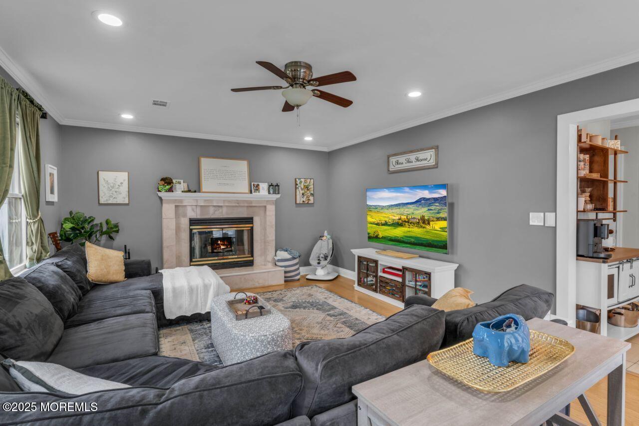 38 Kiwi Loop Howell, NJ 07731 - Photo 10 of 32 a living room with furniture and a flat screen tv