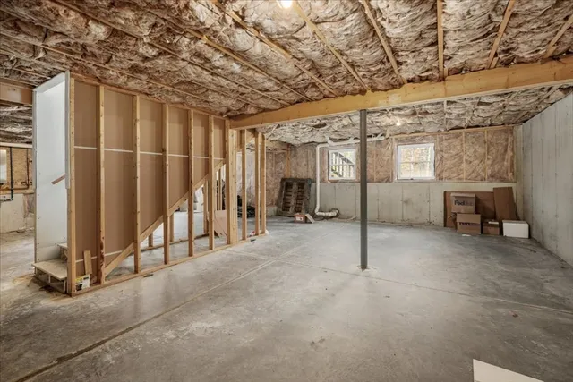 a view of an empty room with wooden walls