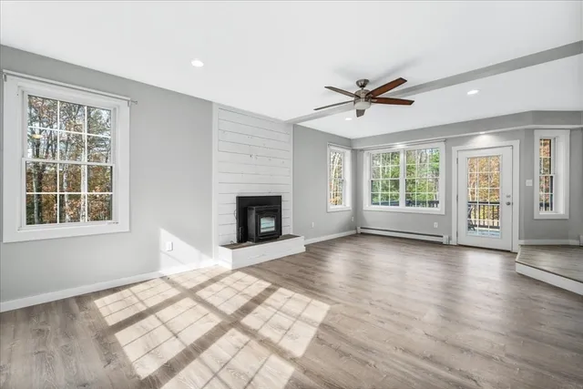 a view of livingroom with furniture window and wooden floor
