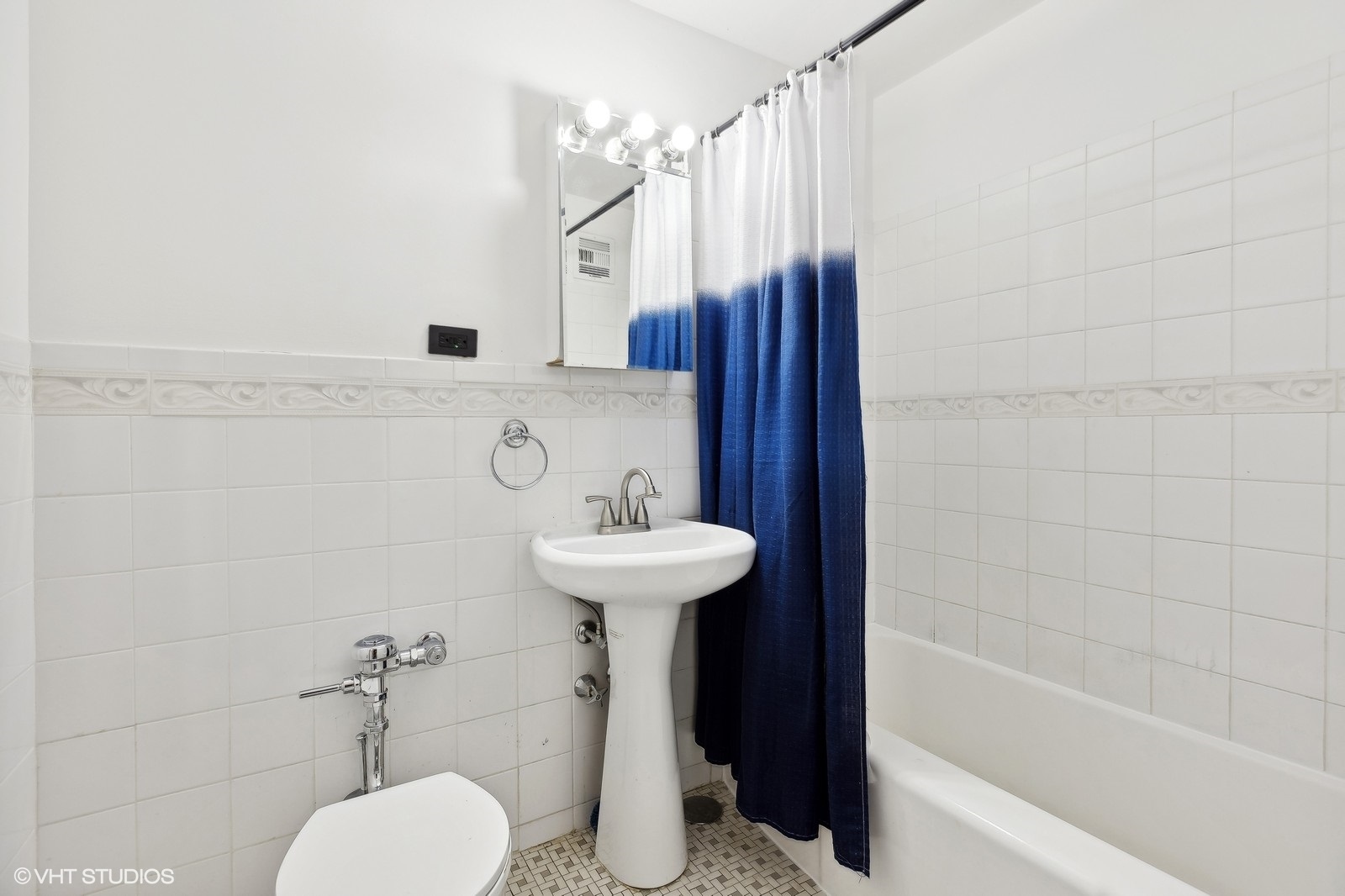 6030 North Sheridan Road, Unit 1403 Chicago, IL 60660 - Photo 7 of 10 a bathroom with a sink toilet and shower