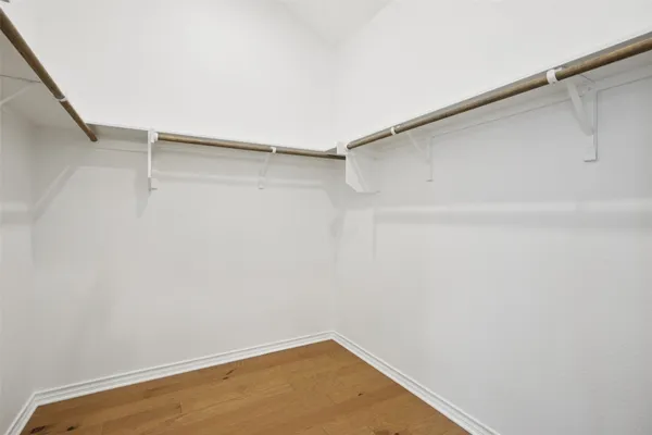 a bathroom with a shower sink and mirror
