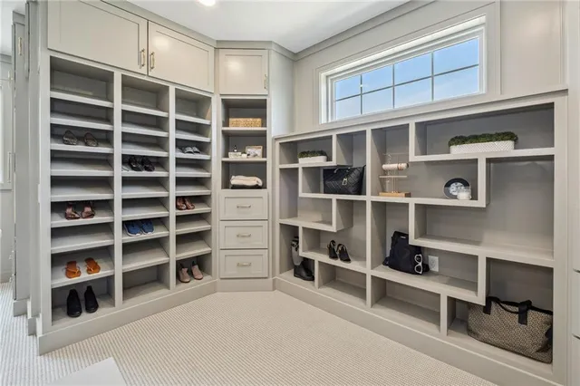 a view of an empty room with empty shelves