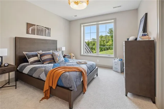 a bedroom with bed and a window