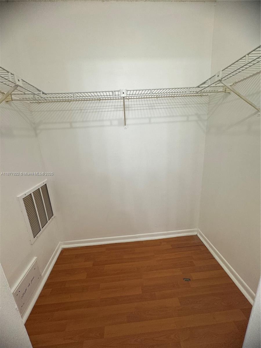 5765 West 25th Court, Unit 206 Hialeah, FL 33016 - Photo 11 of 12 a view of a room with racks on the wall