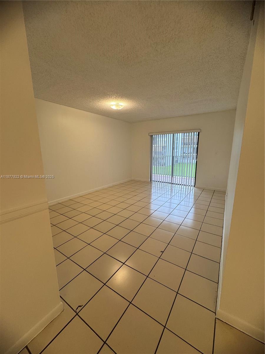 5765 West 25th Court, Unit 206 Hialeah, FL 33016 - Photo 4 of 12 a view of an empty room and window