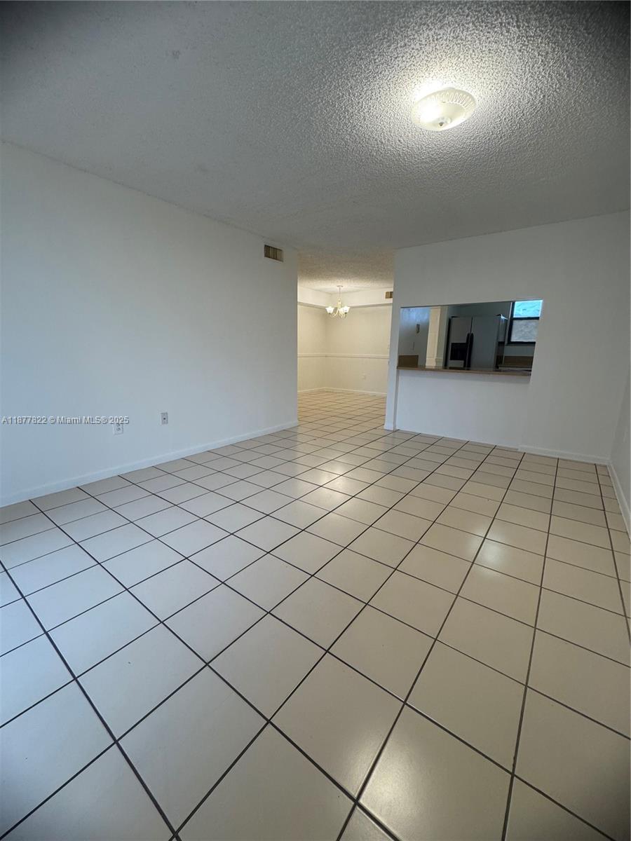 5765 West 25th Court, Unit 206 Hialeah, FL 33016 - Photo 5 of 12 a view of a livingroom and entryway