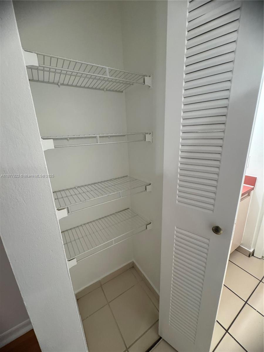 5765 West 25th Court, Unit 206 Hialeah, FL 33016 - Photo 10 of 12 a bathroom with a shower