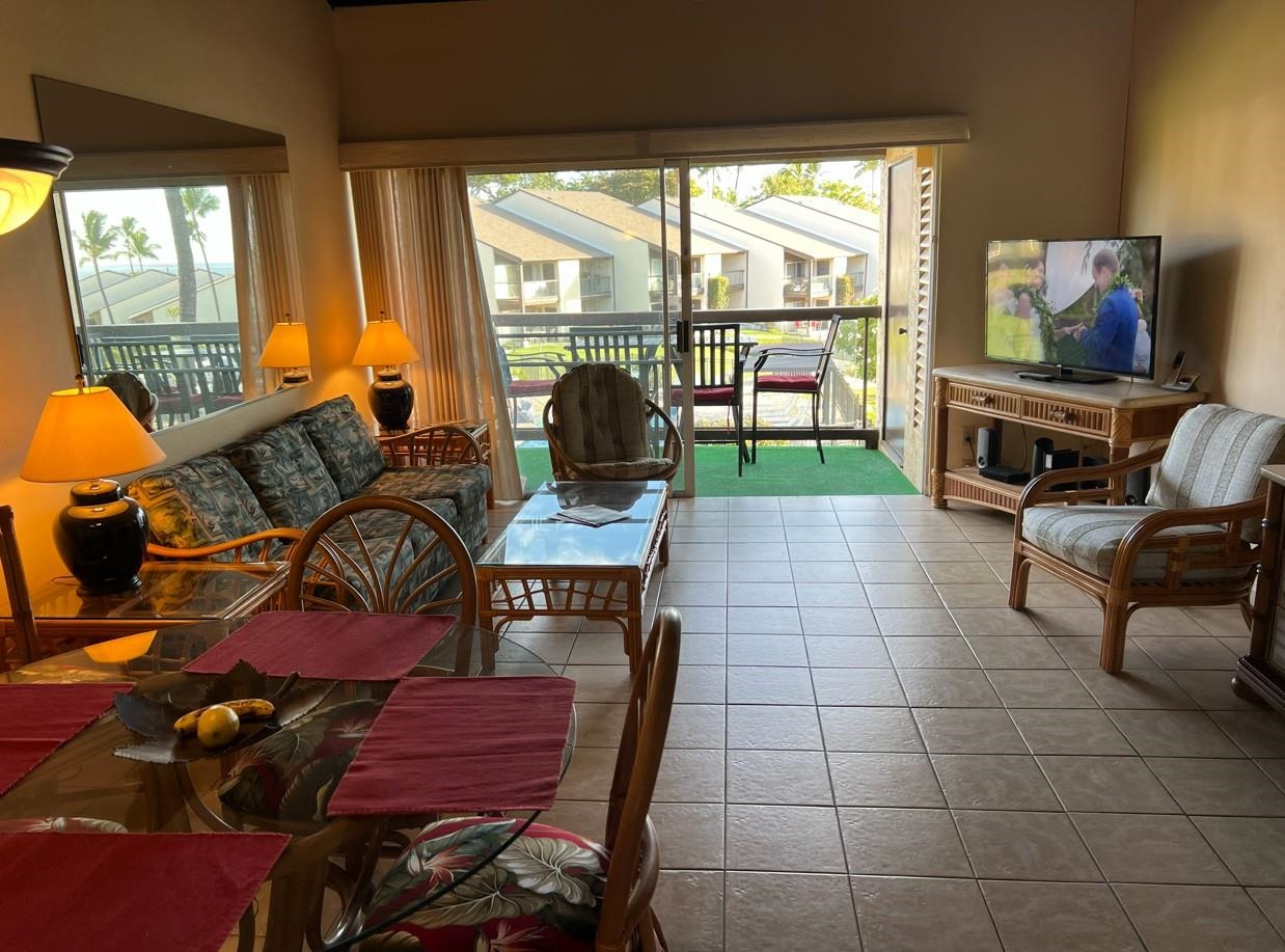 2737 South Kihei Road, Unit 336 Kihei, HI 96753 - Photo 2 of 38 a living room filled with furniture and a flat screen tv