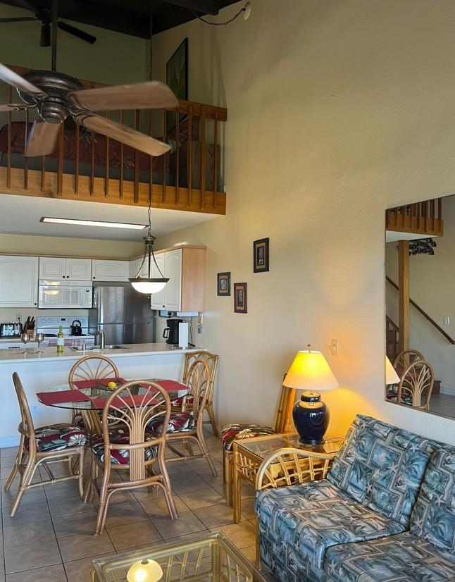 2737 South Kihei Road, Unit 336 Kihei, HI 96753 - Photo 3 of 38 a dining room with furniture and a flat screen tv