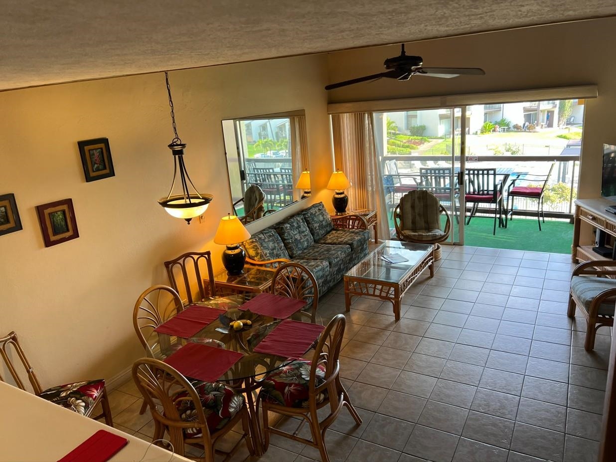 2737 South Kihei Road, Unit 336 Kihei, HI 96753 - Photo 6 of 38 a living room with furniture and a large window