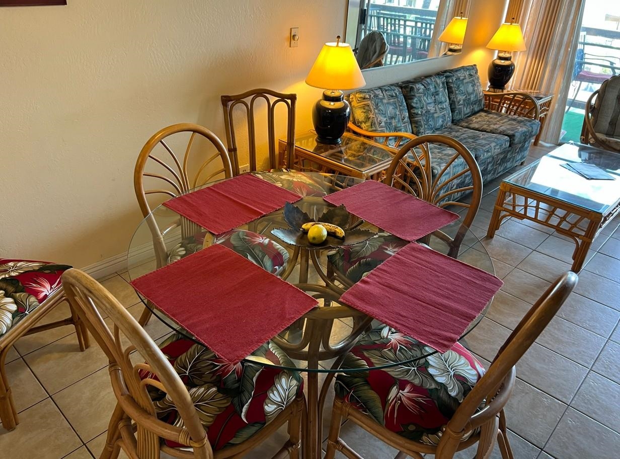 2737 South Kihei Road, Unit 336 Kihei, HI 96753 - Photo 7 of 38 a view of a dining room with furniture and chandelier