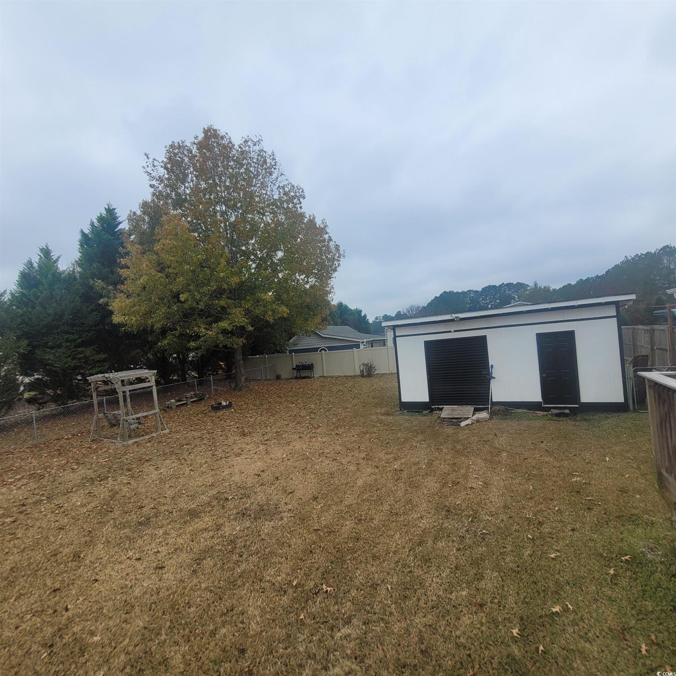 1781 Dixie Court Loris, SC 29569 - Photo 16 of 18 Fenced backyard with an outbuilding
