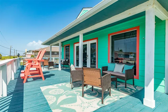 a chairs and table in front of a house