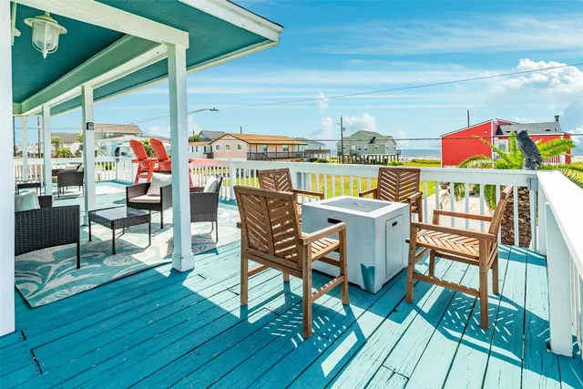 a view of a chairs and table in the balcony