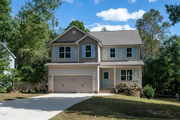front view of a house with a yard
